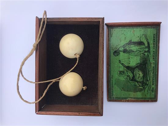 A John Jaques & Son game The Moffillisahn or Indian Castanets, in mahogany slide top box with green label,